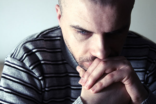 man depressed with cancer-related brain fog