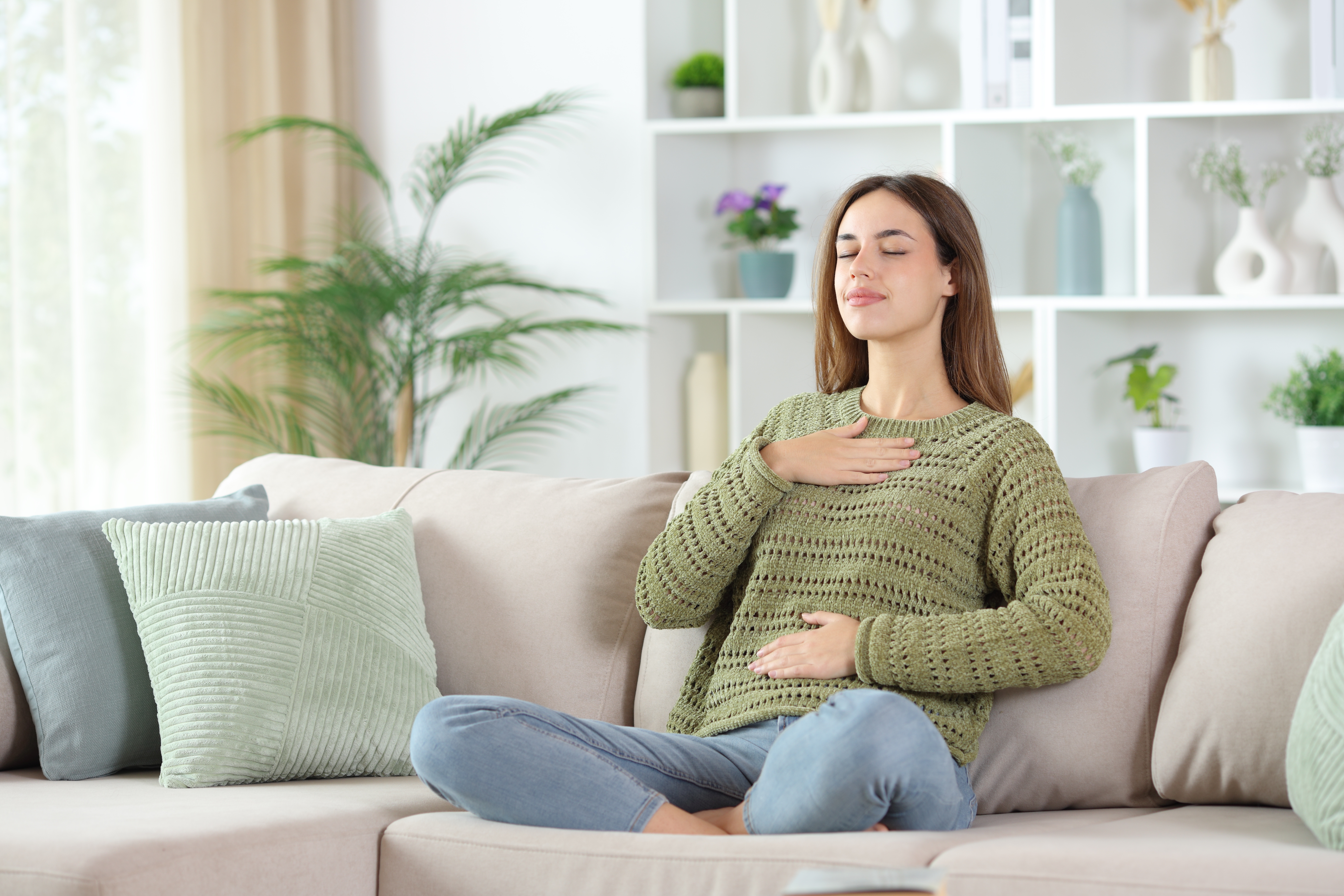 Woman practicing diaphragmatic breathing