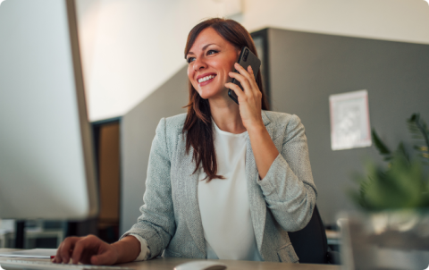 A case manager on a phone call at a desk